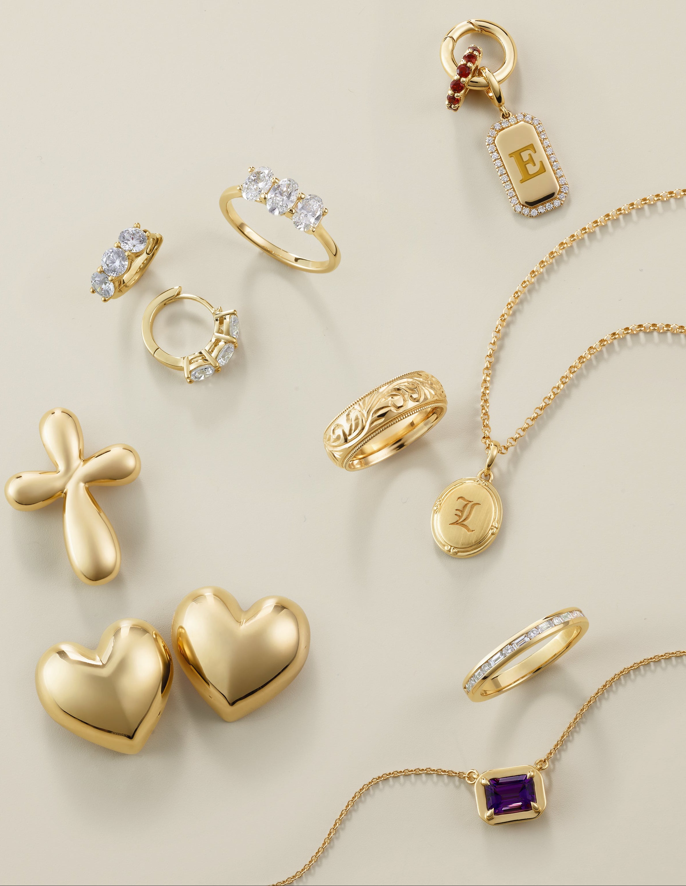 Assortment of gold rings, lockets, pendants and earrings