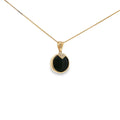 14K yellow gold pendant with a round black onyx center and four diamond accents.