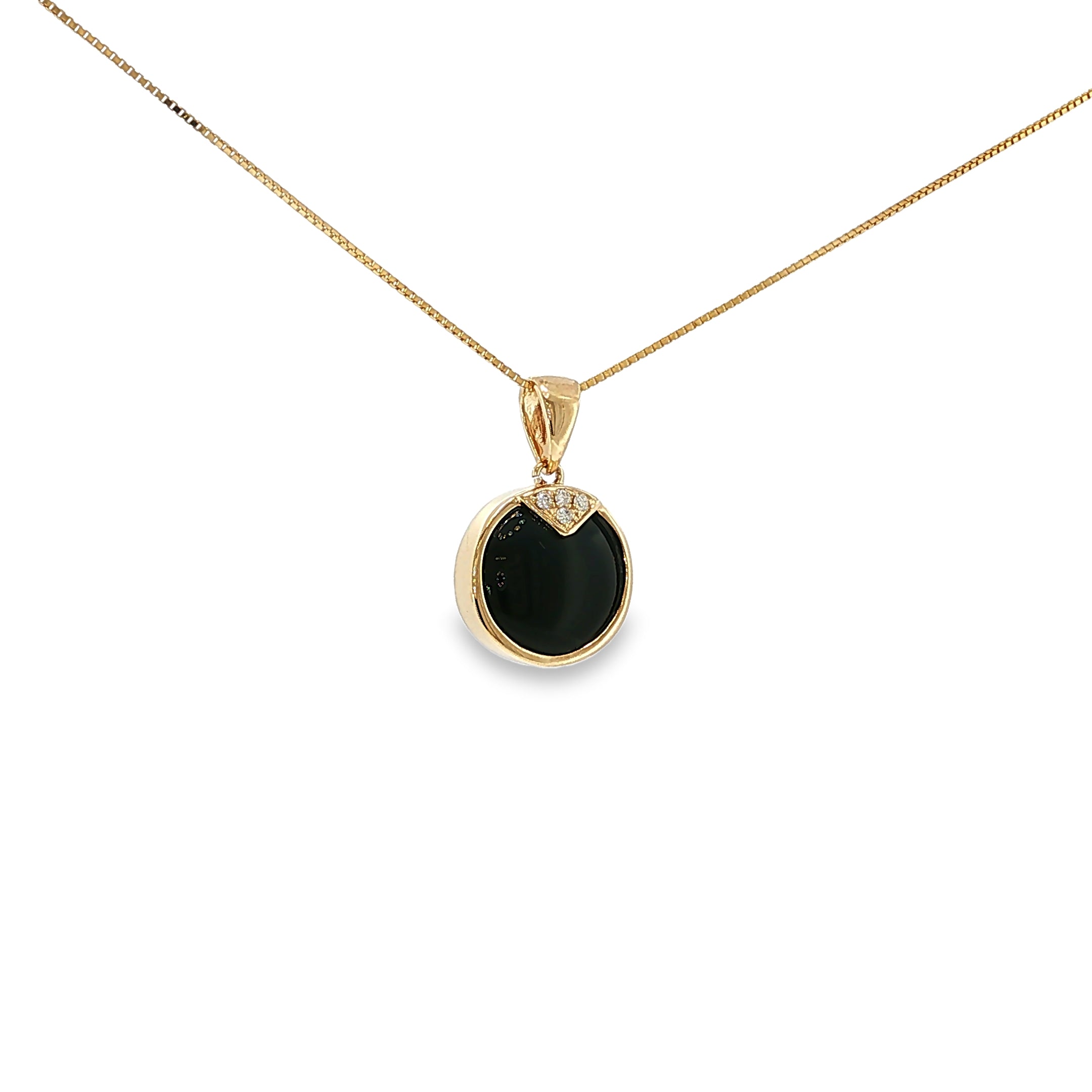 14K yellow gold pendant with a round black onyx center and four diamond accents.