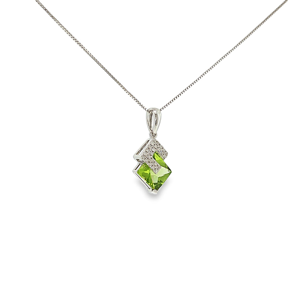 14K white gold geometric pendant with a square green peridot framed by angular diamond accents.