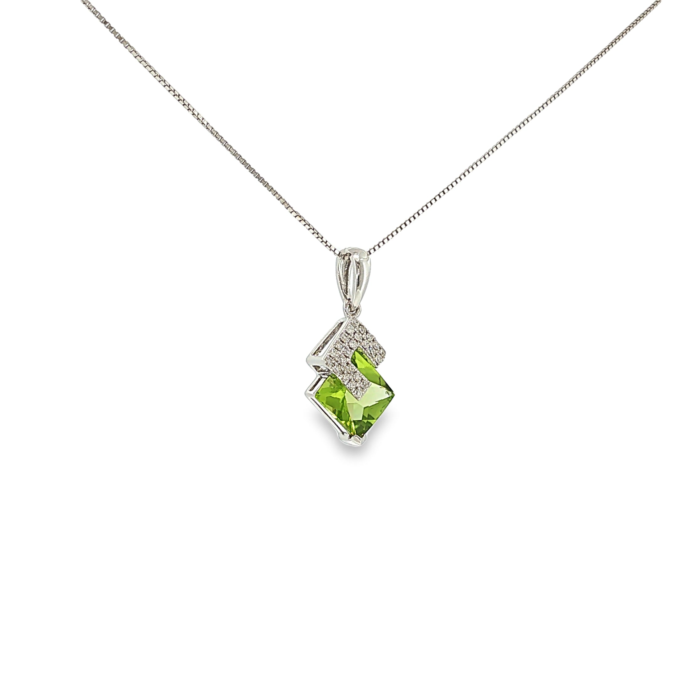 14K white gold geometric pendant with a square green peridot framed by angular diamond accents.