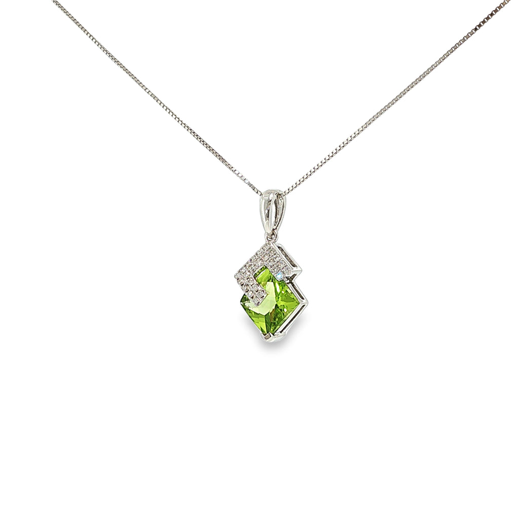 14K white gold geometric pendant with a square green peridot framed by angular diamond accents.