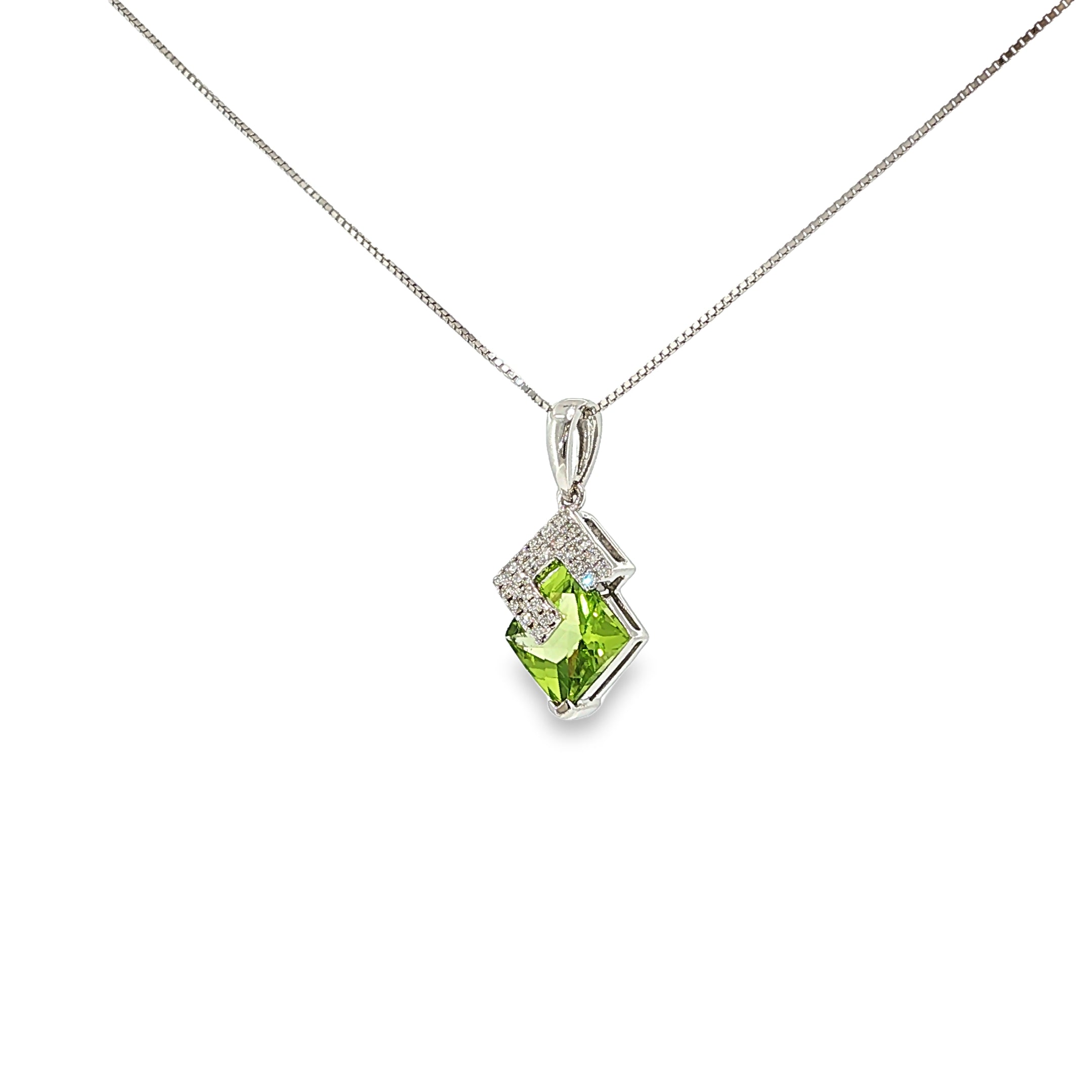 14K white gold geometric pendant with a square green peridot framed by angular diamond accents.