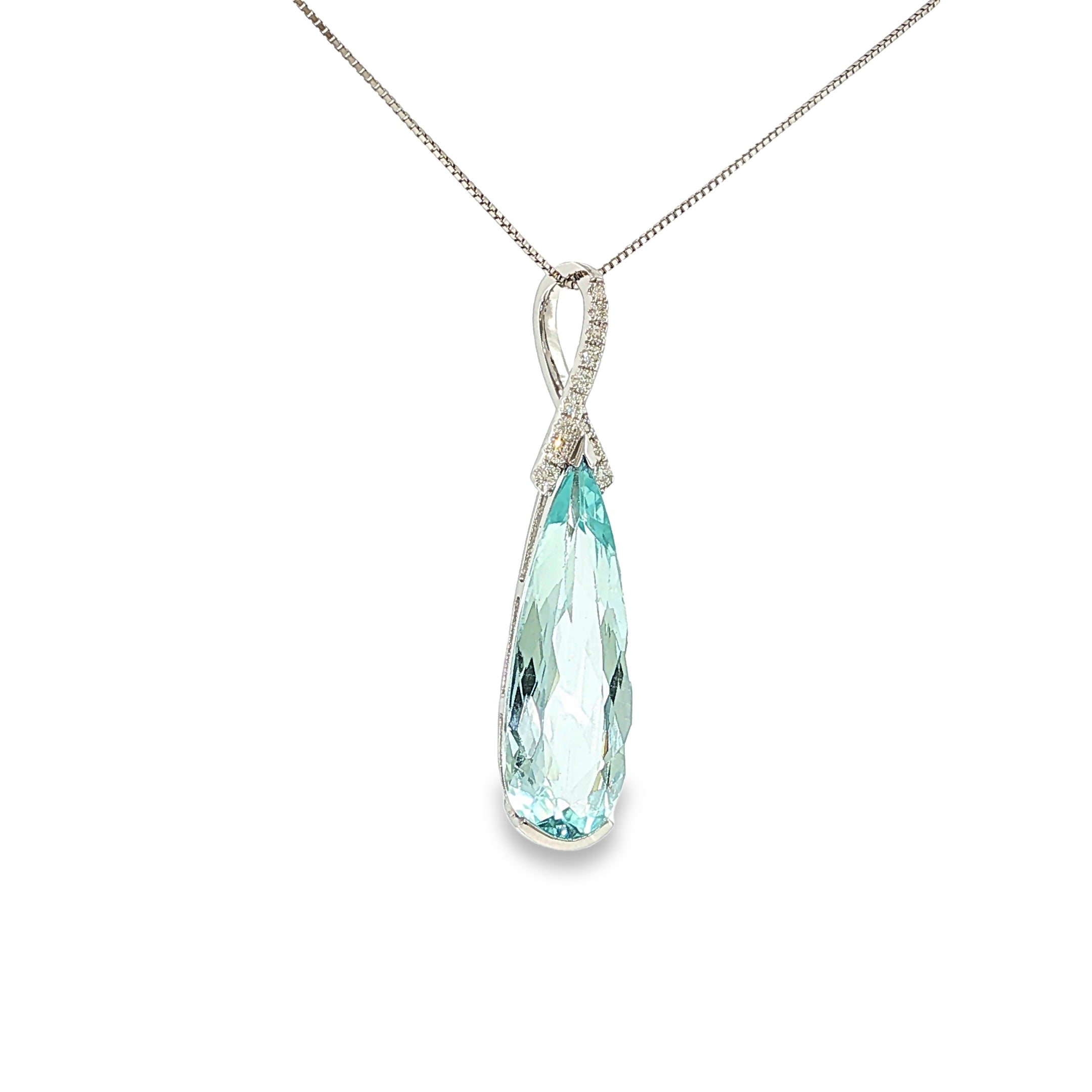 14K white gold pendant with an elongated pear-shaped pale blue aquamarine and diamond-accented sweeping bail.