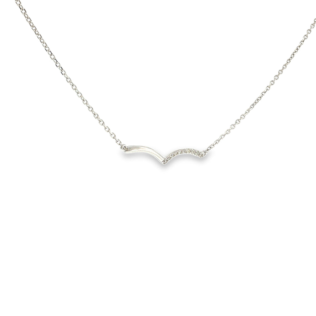 14K white gold asymmetrical wave necklace with a flowing polished design and a row of diamond accents.