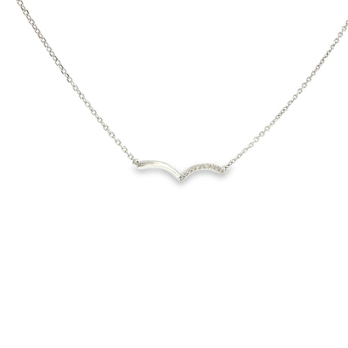 14K white gold asymmetrical wave necklace with a flowing polished design and a row of diamond accents.