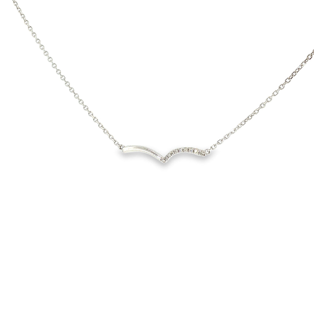 14K white gold asymmetrical wave necklace with a flowing polished design and a row of diamond accents.