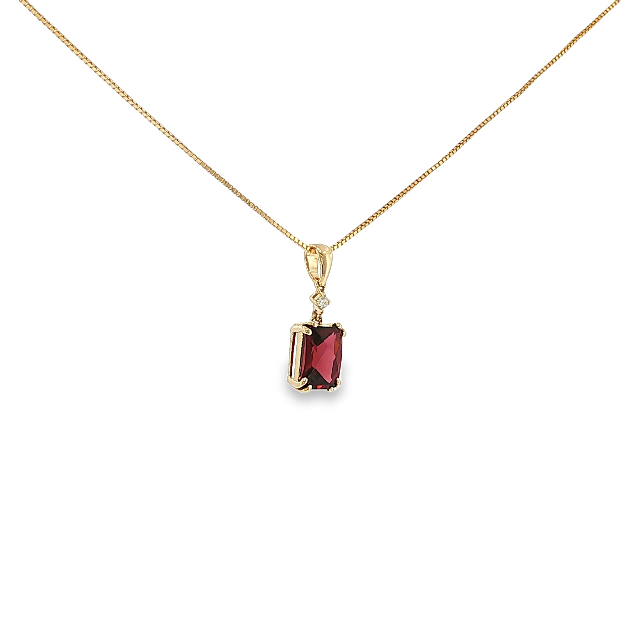 14K yellow gold pendant with a checkerboard-cut deep red garnet and a single diamond accent.