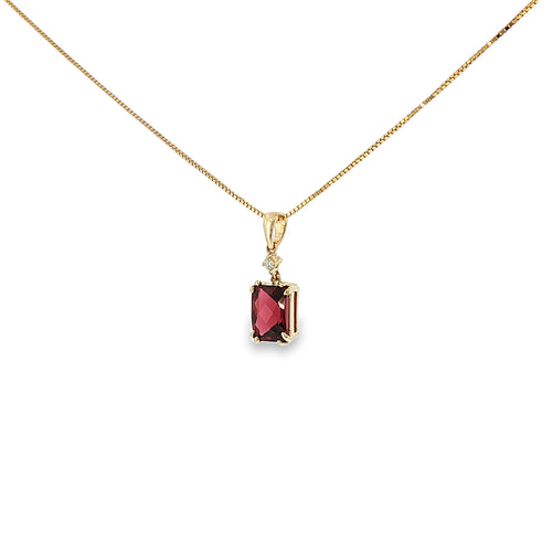 14K yellow gold pendant with a checkerboard-cut deep red garnet and a single diamond accent.