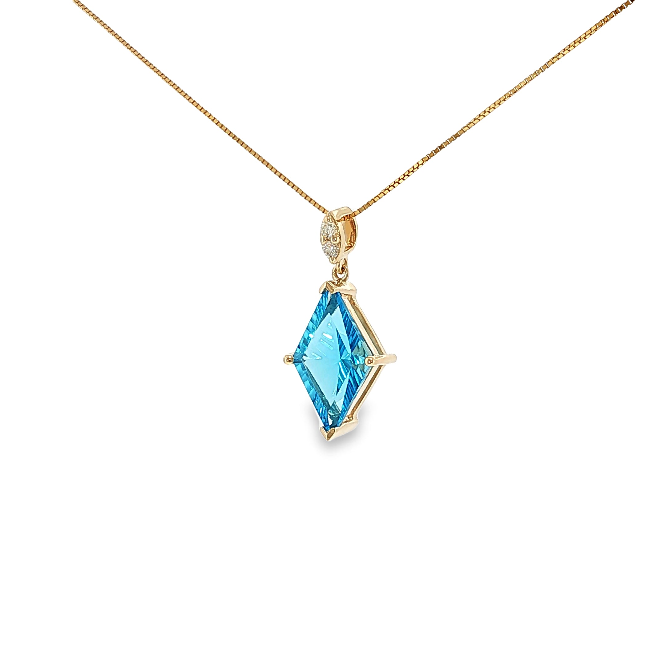 14K yellow gold pendant with a kite-cut Swiss blue topaz and two diamond accents.
