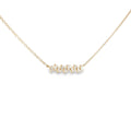 14K yellow gold curved bar necklace with a horizontal row of baguette diamonds.