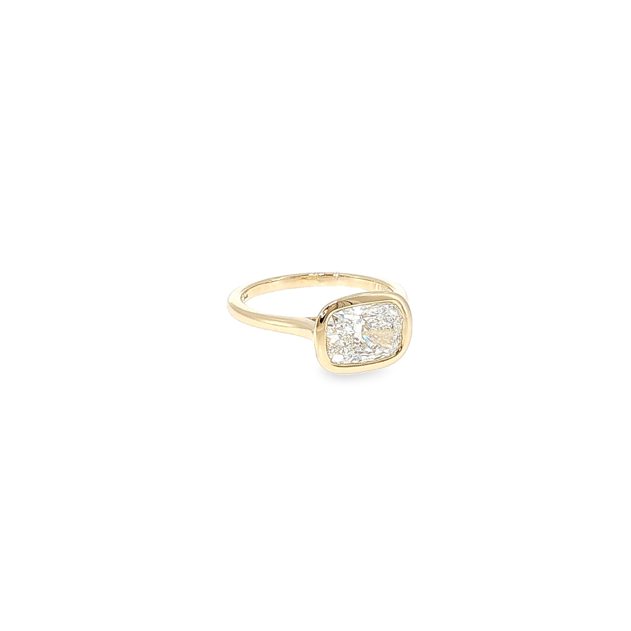 14K yellow gold ring with a cushion-cut lab-grown diamond in a smooth bezel setting.