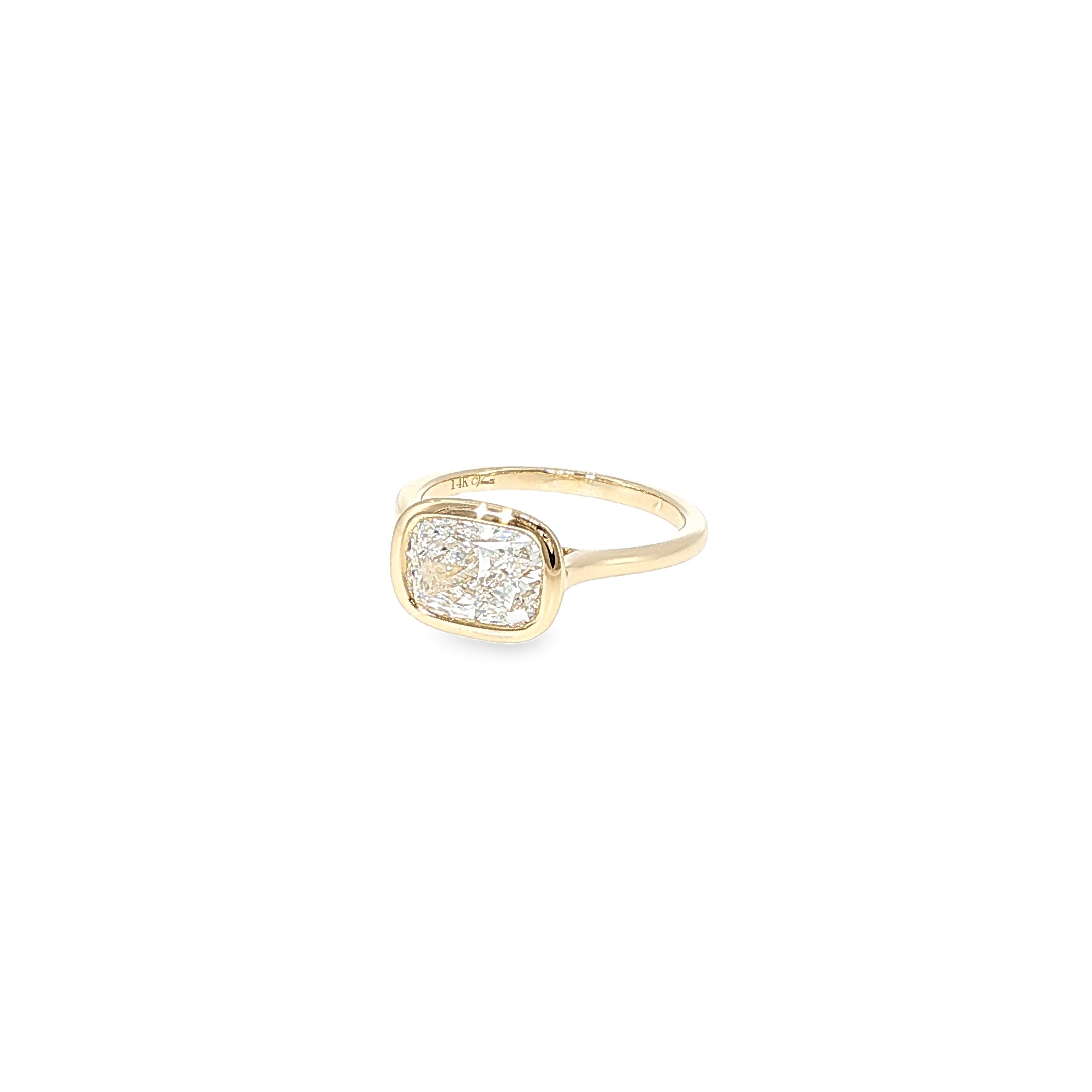 14K yellow gold ring with a cushion-cut lab-grown diamond in a smooth bezel setting.