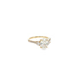 14K yellow gold engagement ring with an oval lab-grown diamond center and natural round diamond accents.