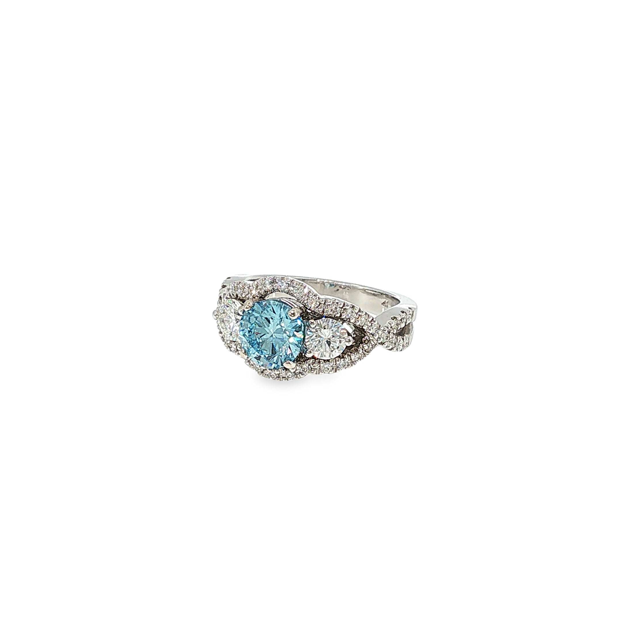14K white gold three-stone ring with a fancy blue round lab-grown diamond center and natural diamond accents.