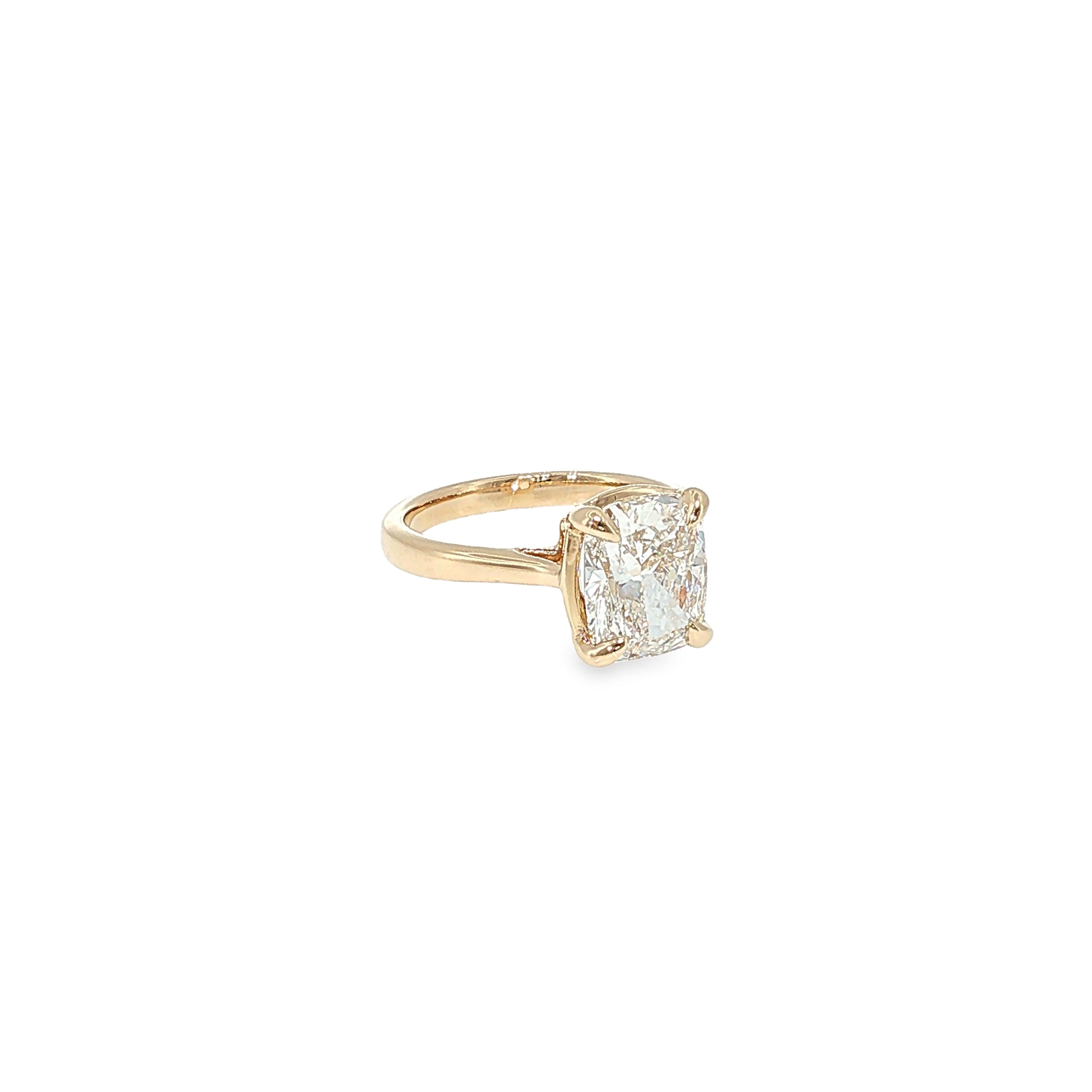 14K yellow gold solitaire engagement ring with a cushion-cut lab-grown diamond center.