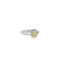 14K white gold split-shank ring with a cushion-cut fancy light yellow diamond surrounded by a diamond halo.
