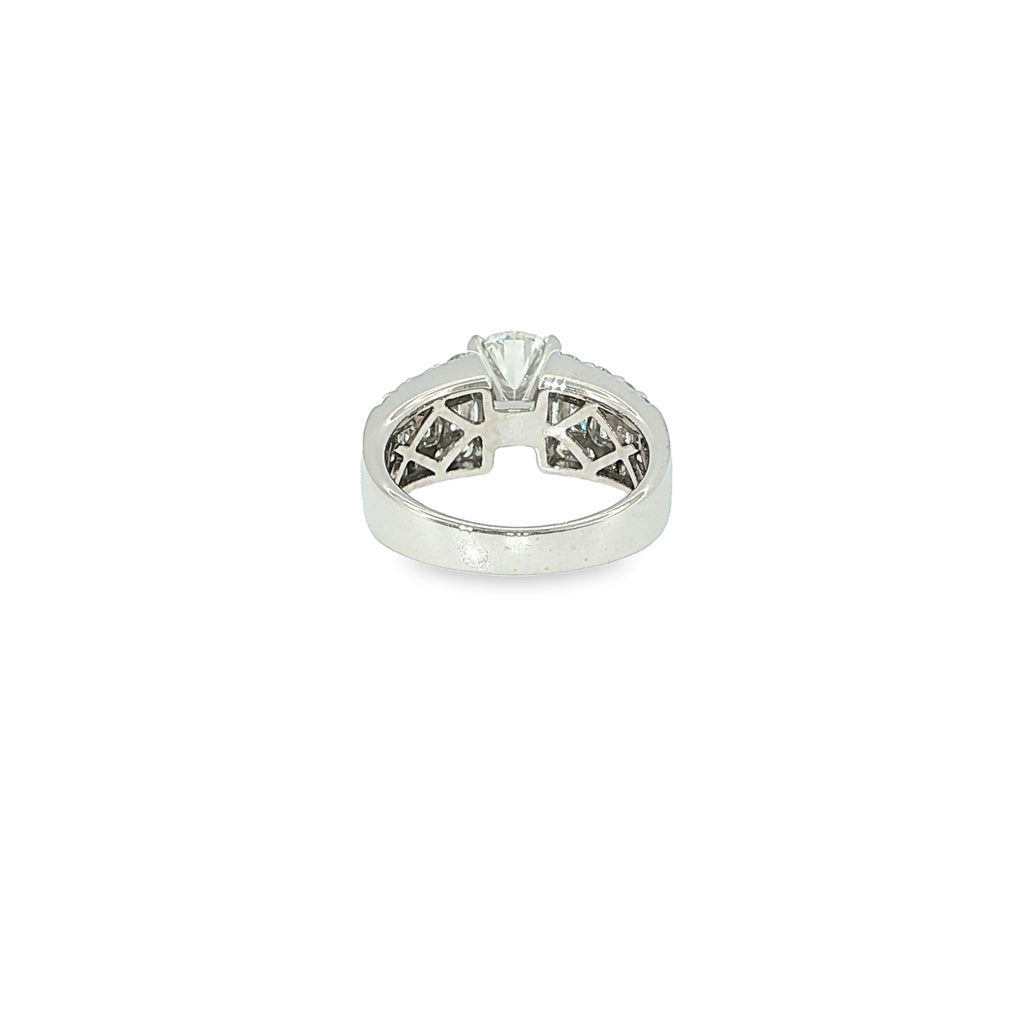 14K white gold engagement ring with a round brilliant diamond center and multiple rows of baguette and round diamonds.
