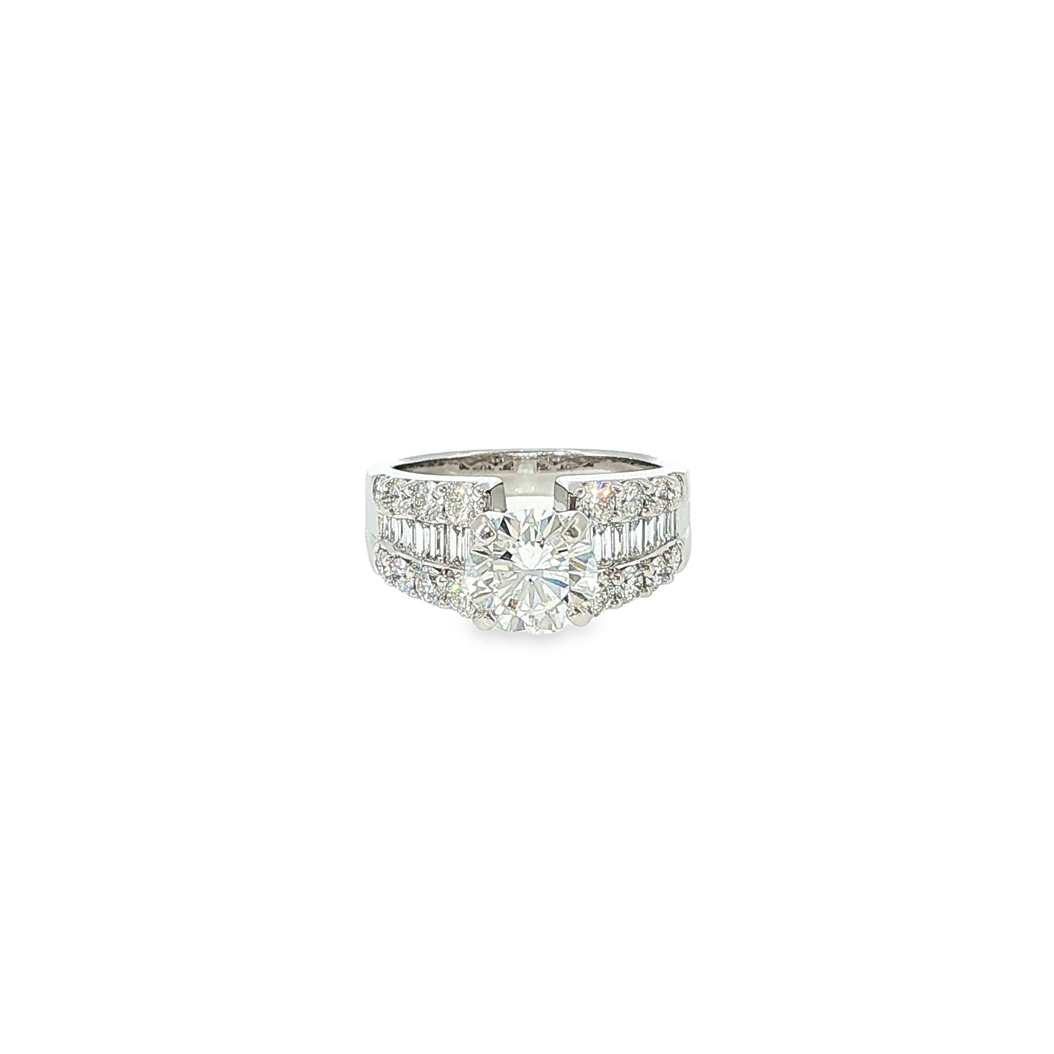14K white gold engagement ring with a round brilliant diamond center and multiple rows of baguette and round diamonds.