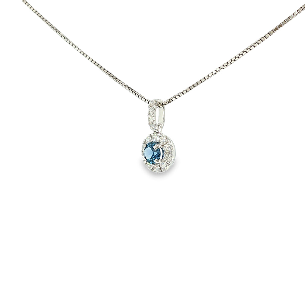 14K white gold pendant with a Montana Yogo sapphire surrounded by a diamond halo and diamond-accented bail.