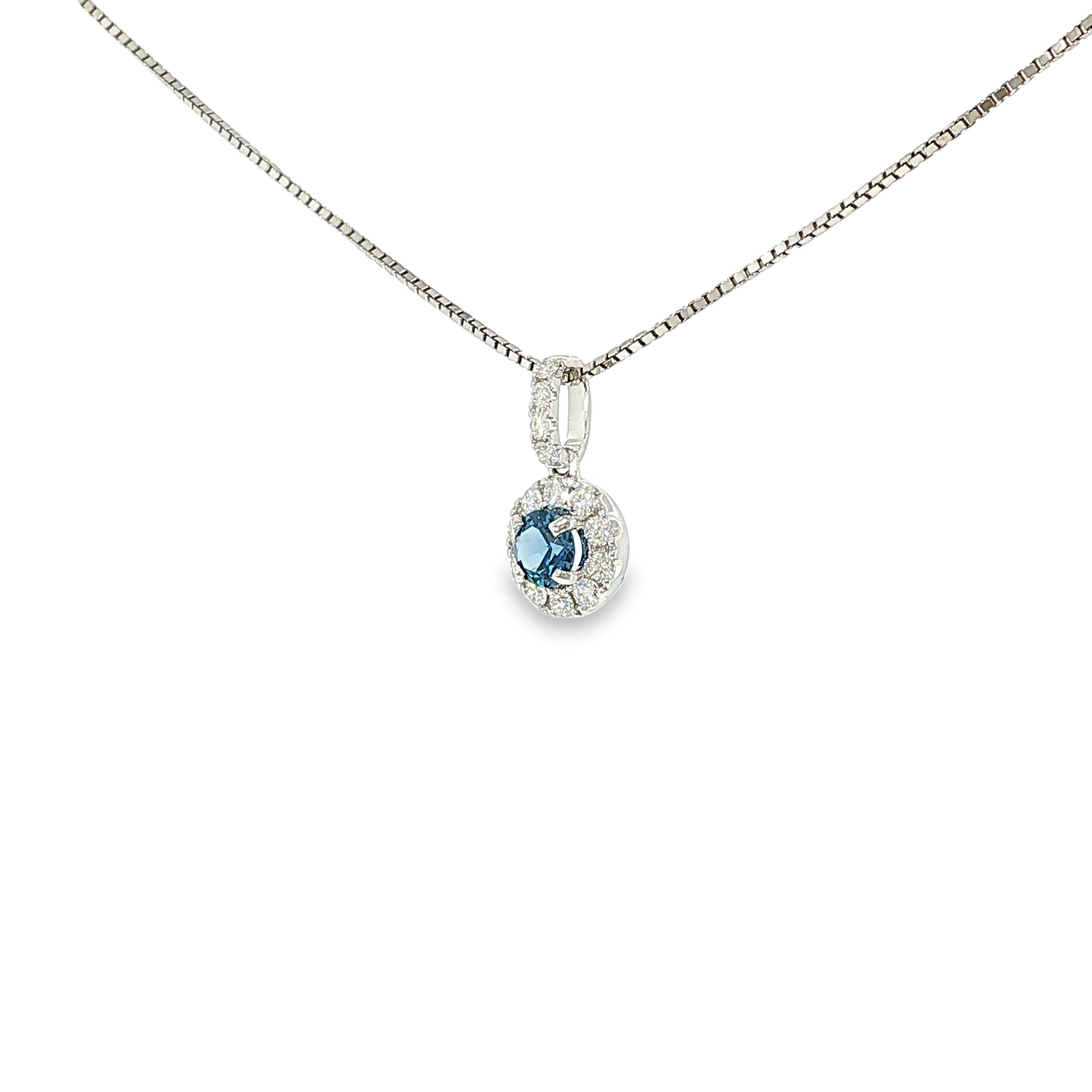 14K white gold pendant with a Montana Yogo sapphire surrounded by a diamond halo and diamond-accented bail.