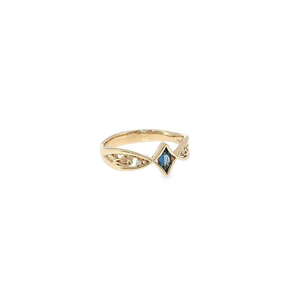 14K yellow gold split-shank ring with a marquise Montana Yogo sapphire, openwork detailing and a diamond accent.