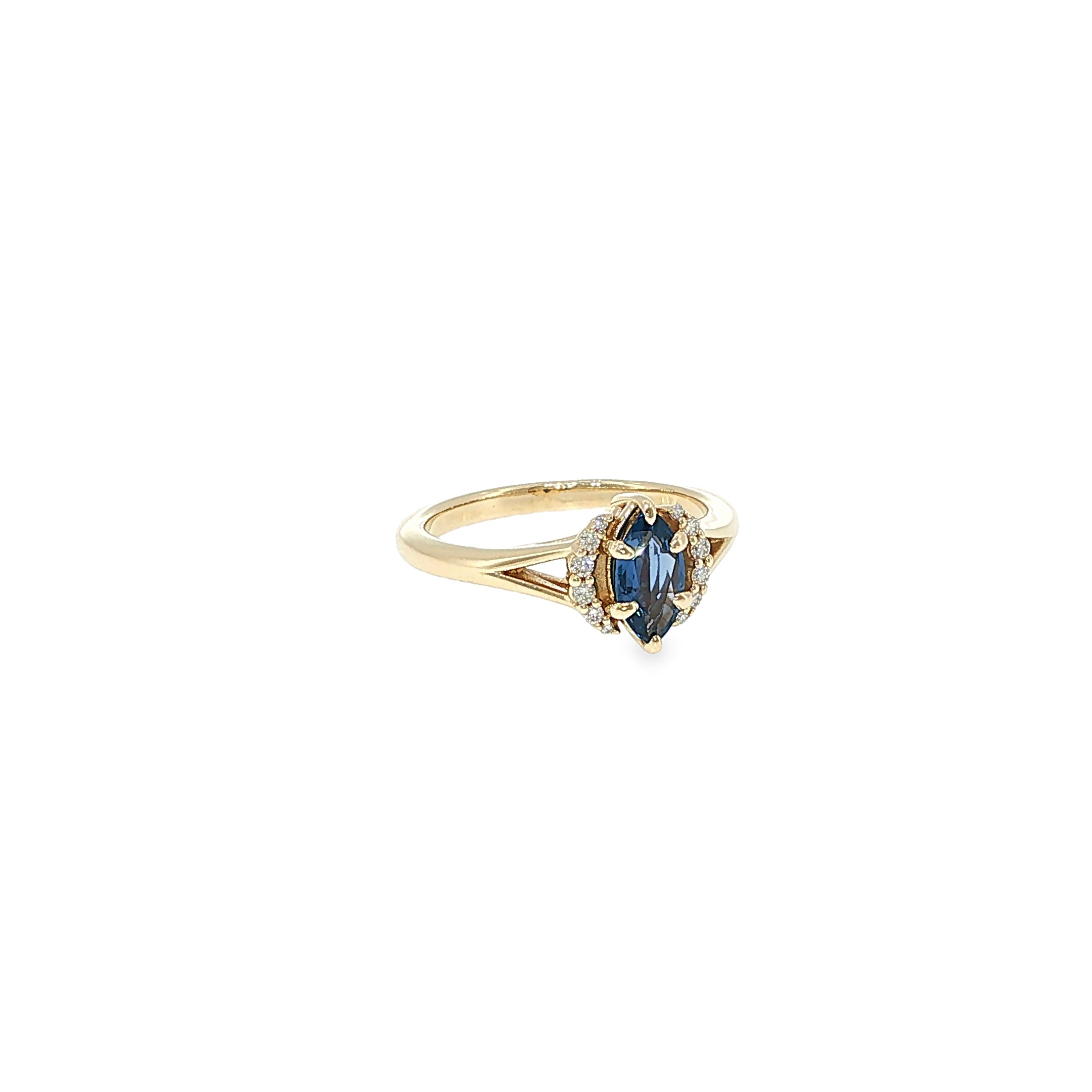 14K yellow gold split-shank ring with a marquise Montana Yogo sapphire surrounded by a diamond halo.