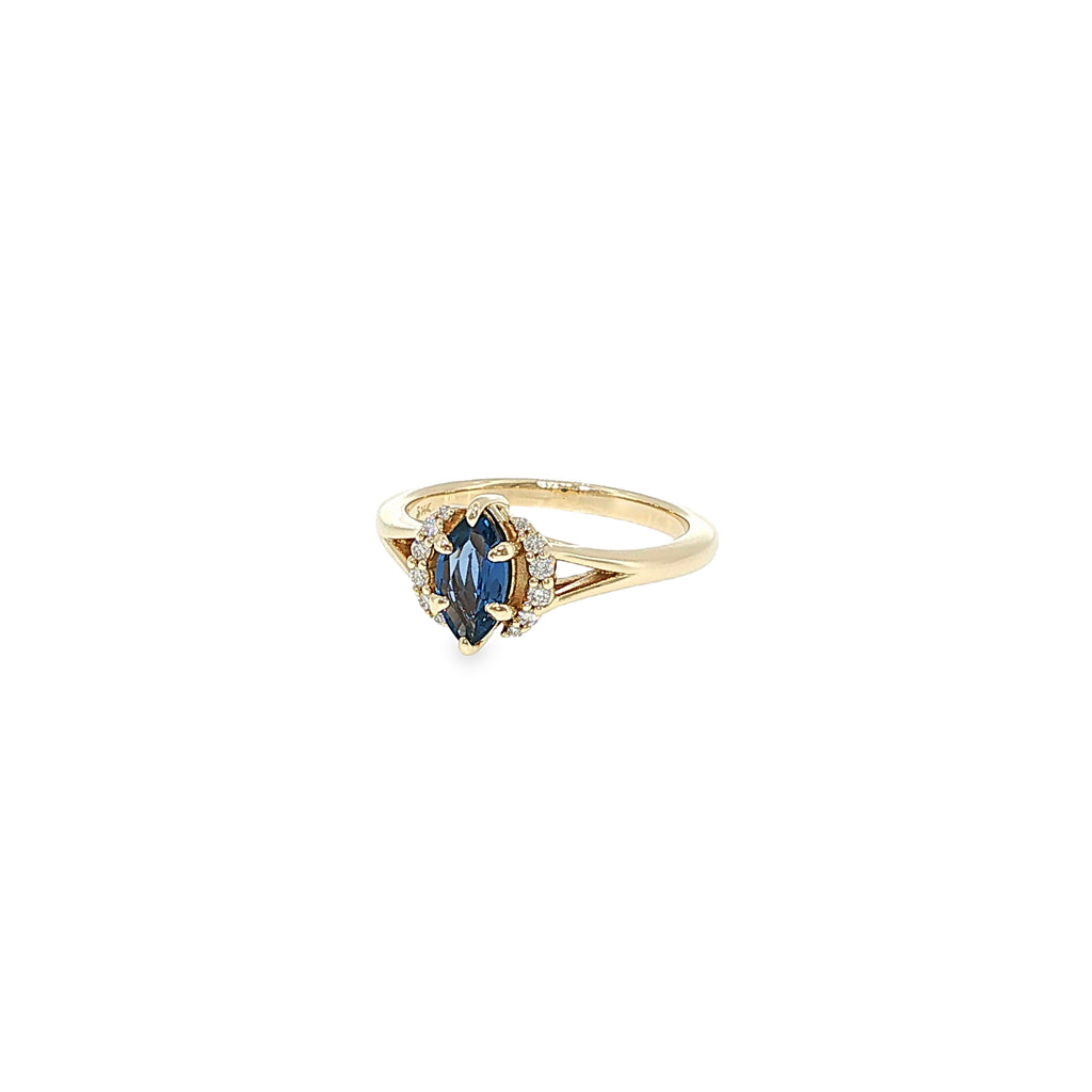 14K yellow gold split-shank ring with a marquise Montana Yogo sapphire surrounded by a diamond halo.
