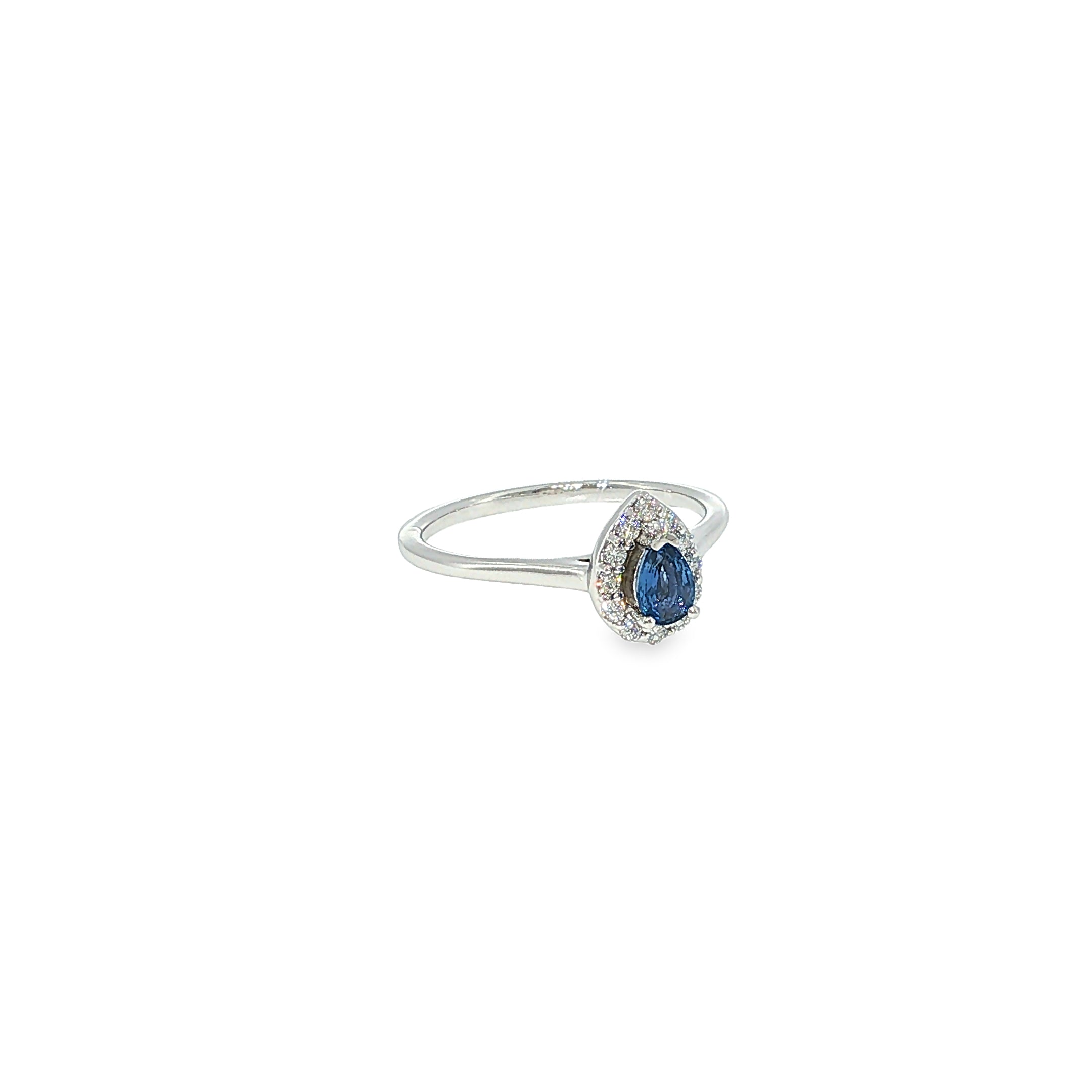 14K white gold ring with a pear-shaped Montana Yogo sapphire surrounded by a curved diamond halo.