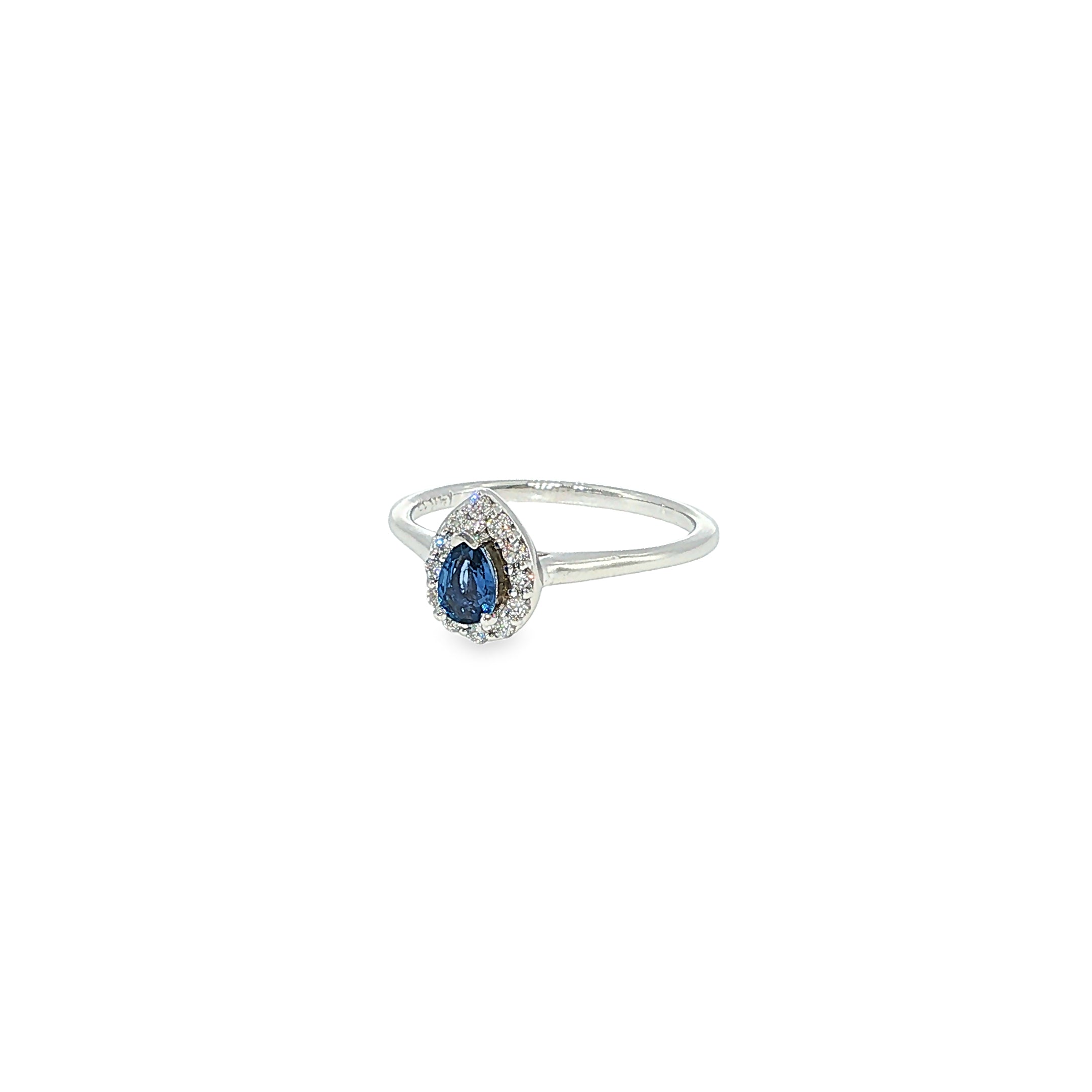 14K white gold ring with a pear-shaped Montana Yogo sapphire surrounded by a curved diamond halo.