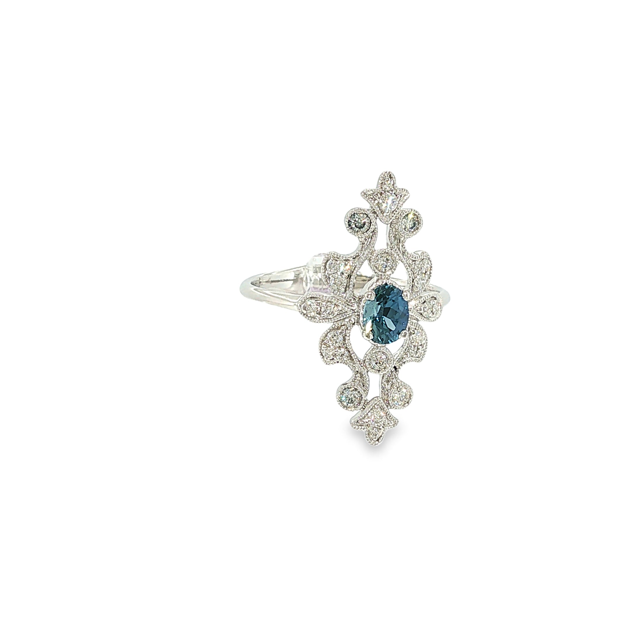 14K white gold ring with an oval Montana Yogo sapphire, diamond accents, milgrain and openwork detailing.