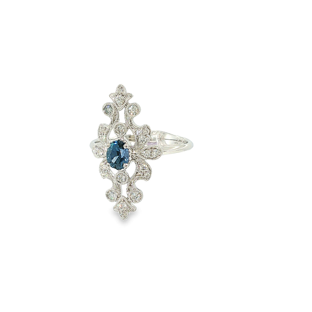 14K white gold ring with an oval Montana Yogo sapphire, diamond accents, milgrain and openwork detailing.
