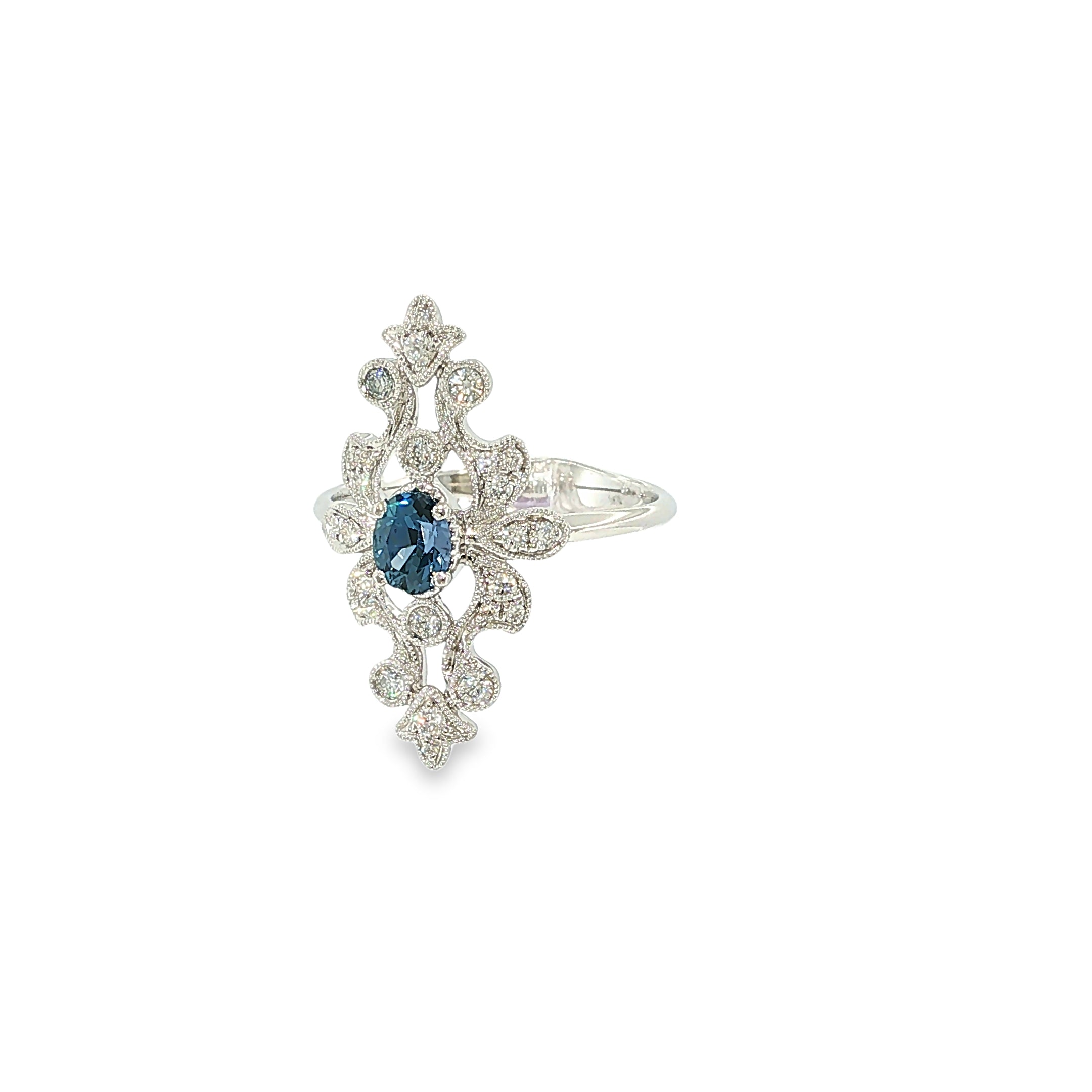 14K white gold ring with an oval Montana Yogo sapphire, diamond accents, milgrain and openwork detailing.