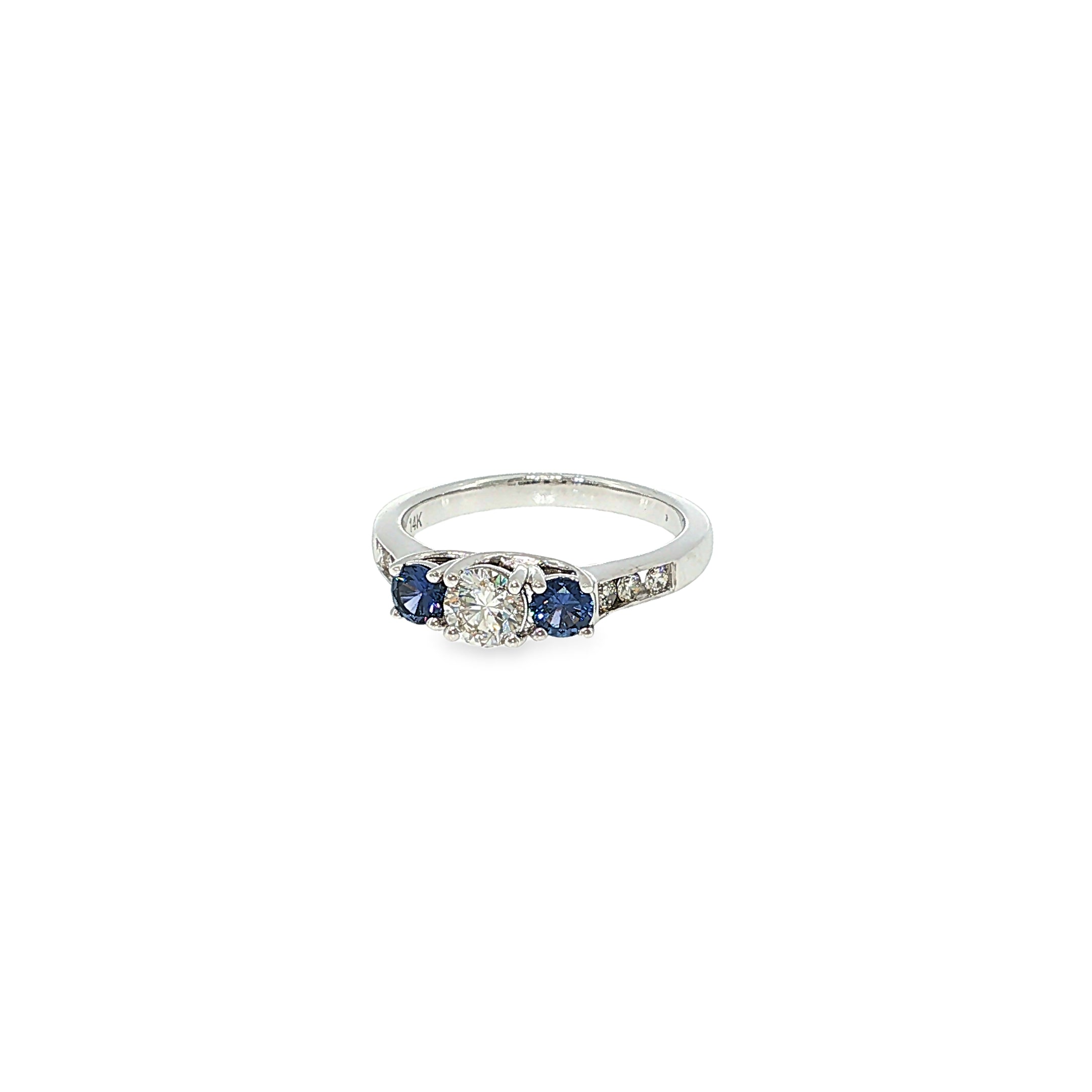 14K white gold three-stone ring with a round diamond center and two round Montana Yogo sapphires.