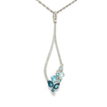 14K white gold pear-shaped necklace with mixed blue topaz gemstones and diamond accents, shown angled to the left.