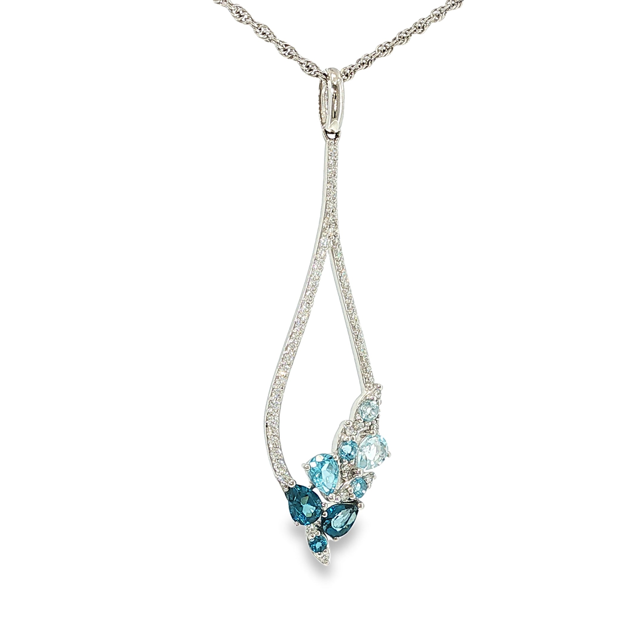 14K white gold pear-shaped necklace with mixed blue topaz gemstones and diamond accents, shown angled to the left.