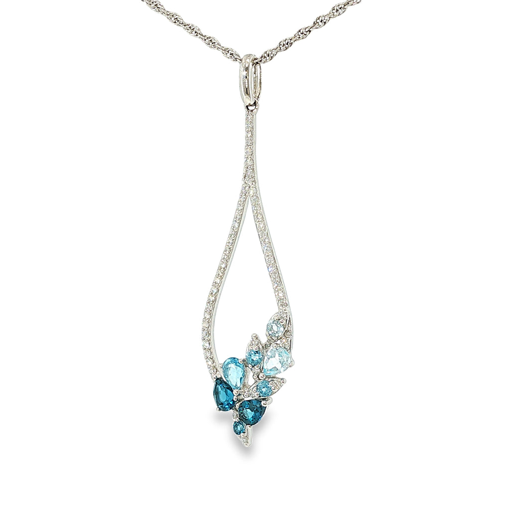 14K white gold pear-shaped necklace with mixed blue topaz gemstones and diamond accents, shown angled to the right.