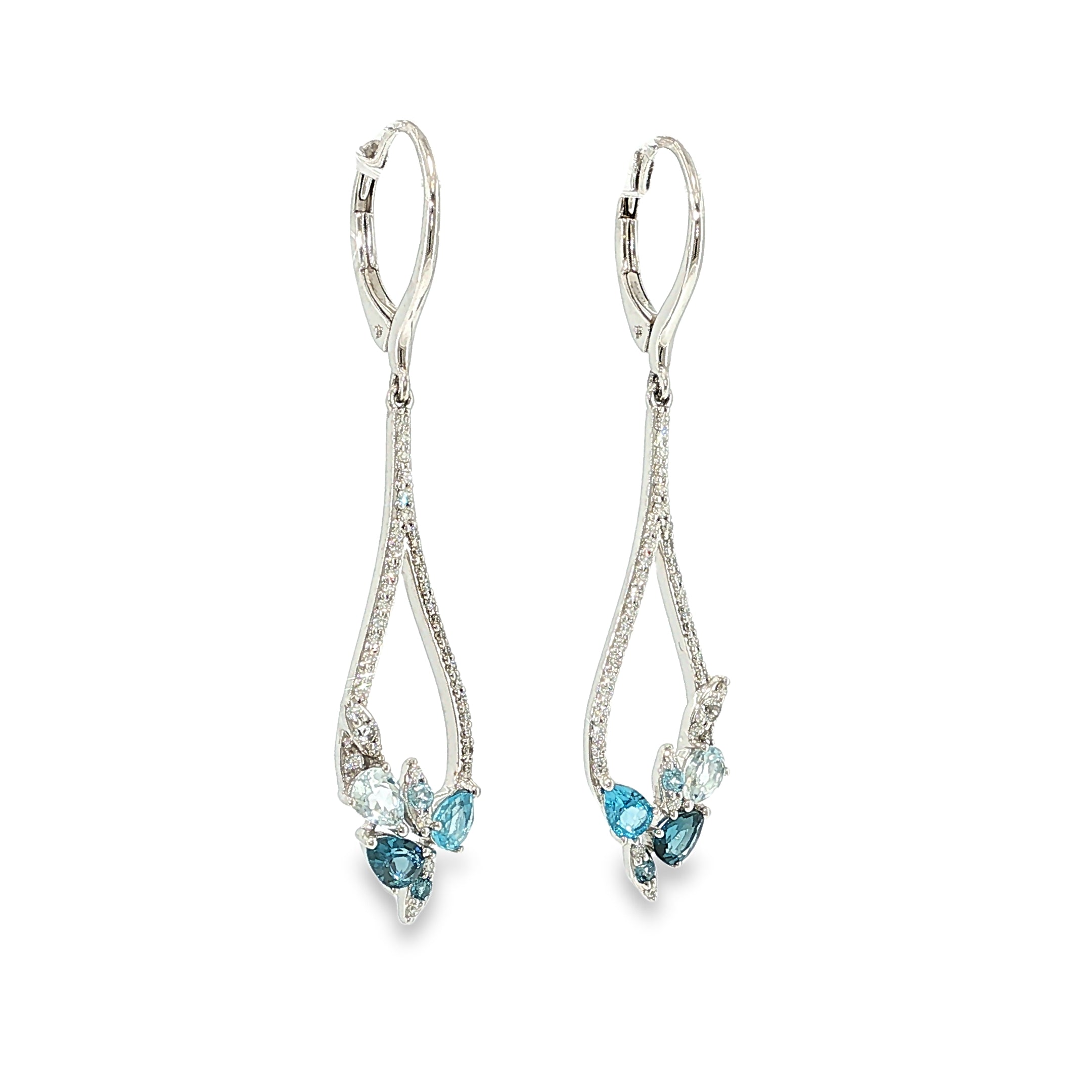 14K white gold pear-frame dangle earrings with mixed blue topaz gemstones and diamond accents, shown angled to the left.