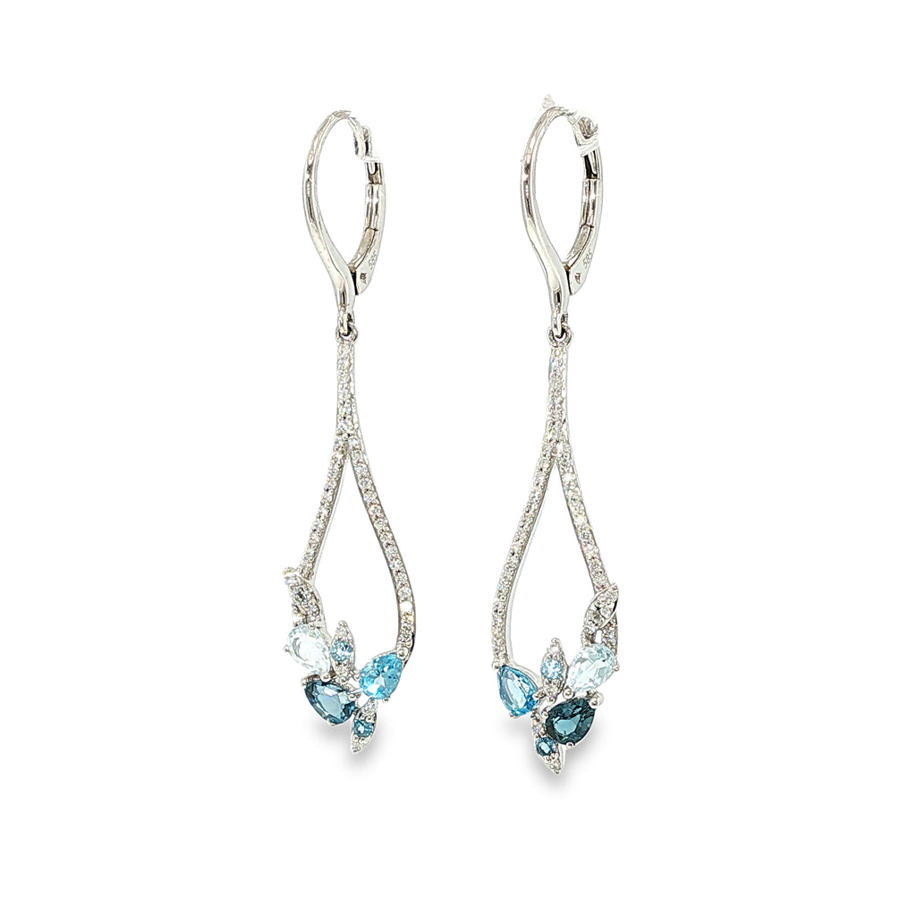 14K white gold pear-frame dangle earrings with mixed blue topaz gemstones and diamond accents, shown angled to the right.