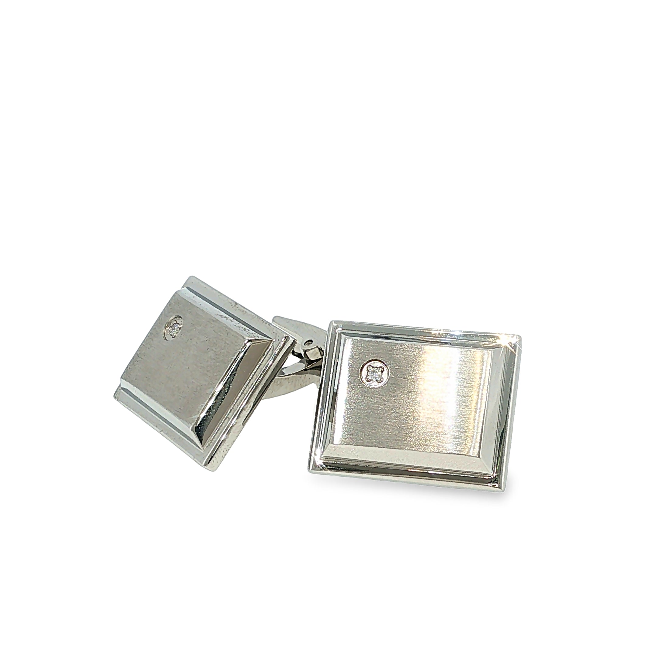 Brushed stainless steel rectangular cuff links with single cubic zirconia accents, shown angled to the right.
