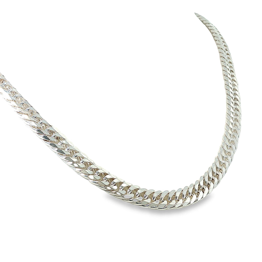 Sterling silver curb chain necklace with double diamond-cut detailing, shown angled to the right.