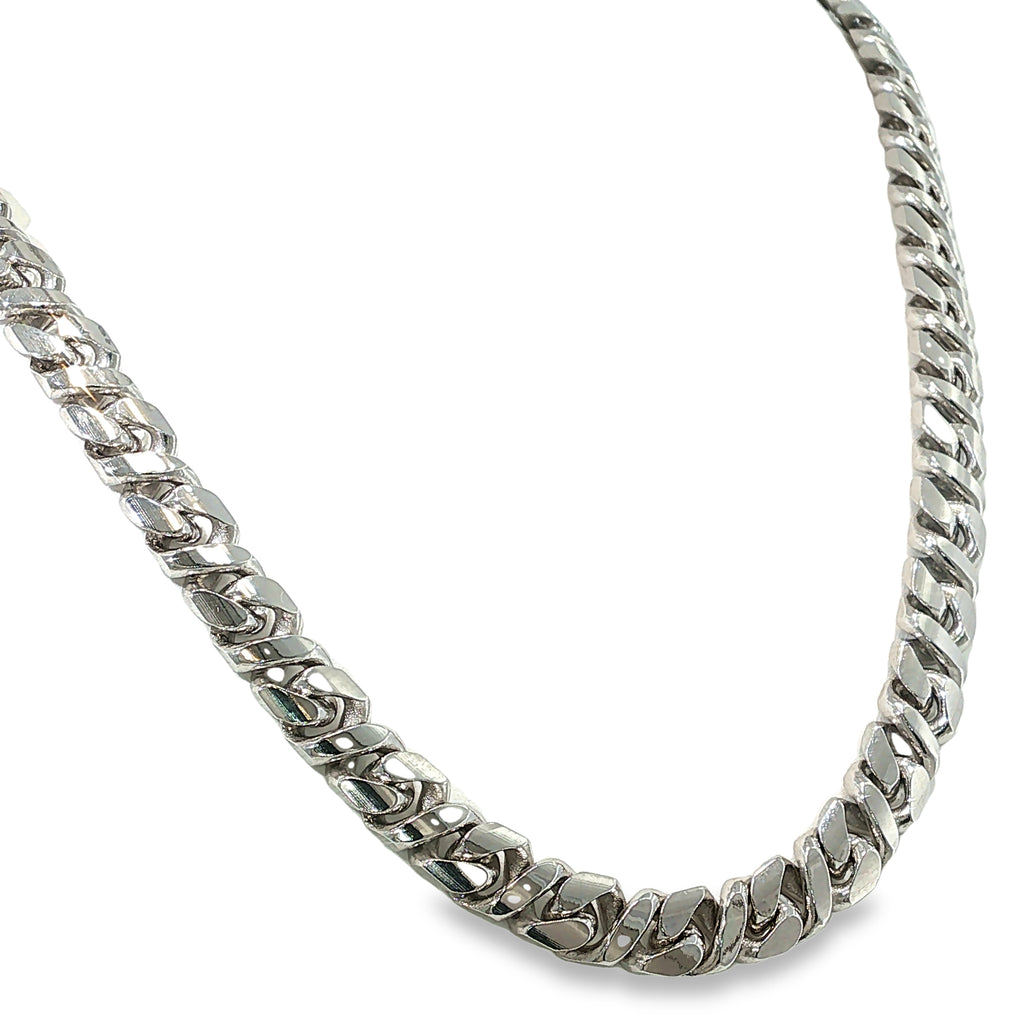 Sterling silver curb chain necklace with diamond-cut detailing and broad polished links, shown angled to the right.