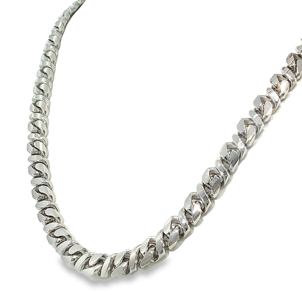 Sterling silver curb chain necklace with diamond-cut detailing and broad polished links, shown angled to the left.