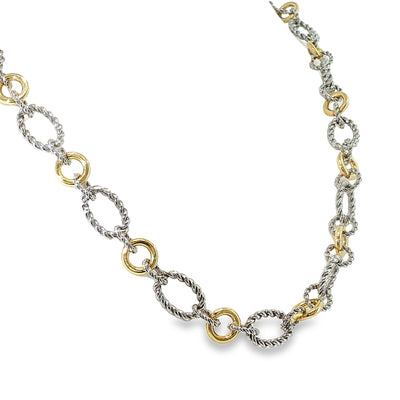 Sterling silver and 18K yellow gold necklace with alternating twisted and polished multi-shape links, shown angled to the right.