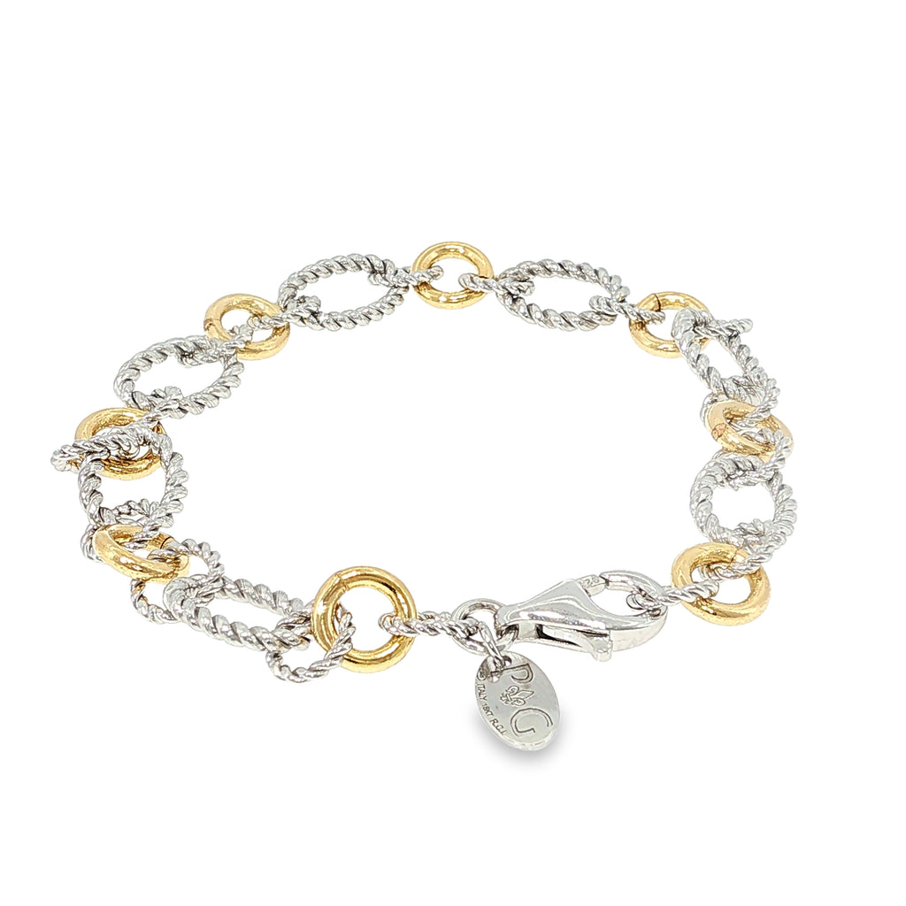Sterling silver and 18K yellow gold bracelet with twisted and polished multi-shape links, shown angled to the right.