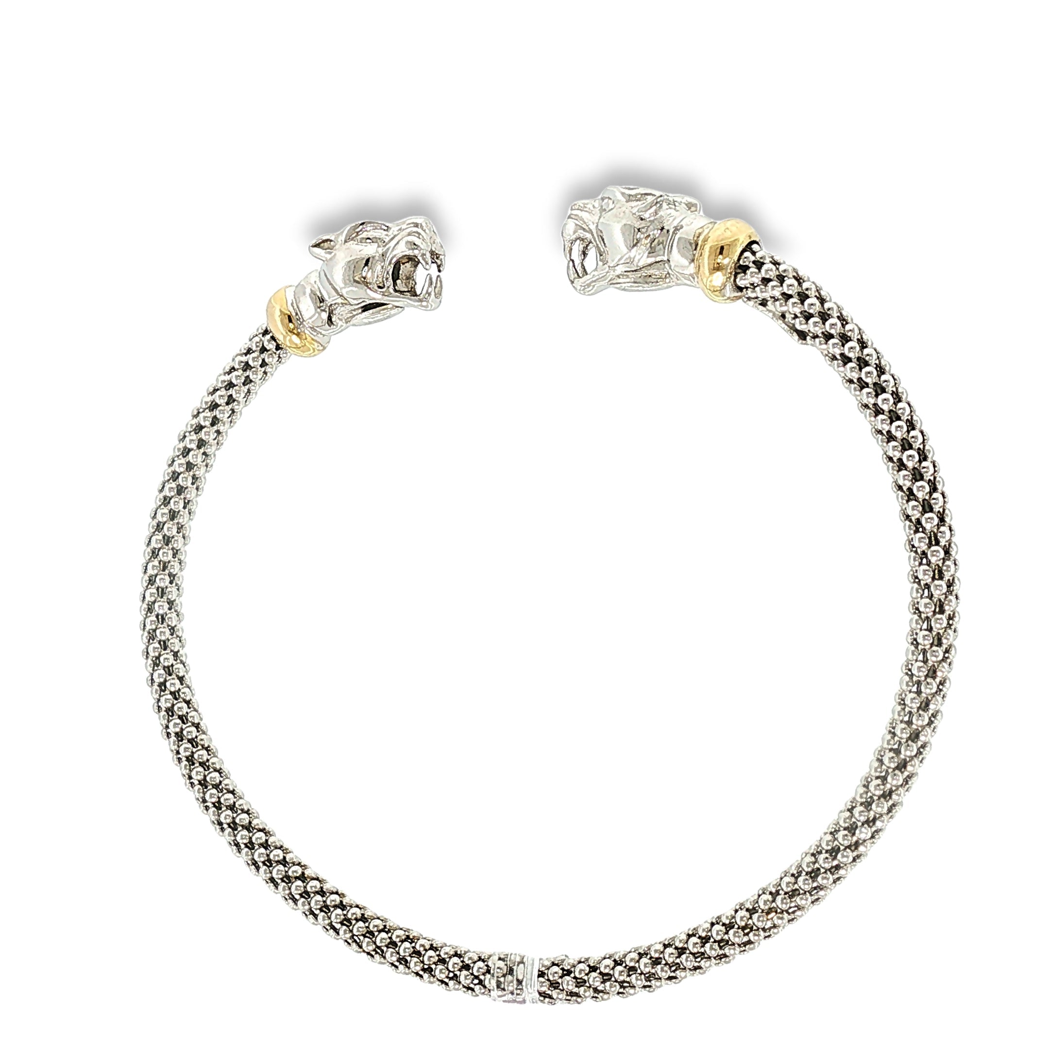 Woven sterling silver cuff bracelet with sculpted panther heads, diamond accents, and 18K yellow gold details, shown angled to the left.