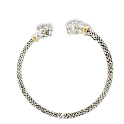 Woven sterling silver cuff bracelet with sculpted panther heads, diamond accents, and 18K yellow gold details, shown angled to the left.