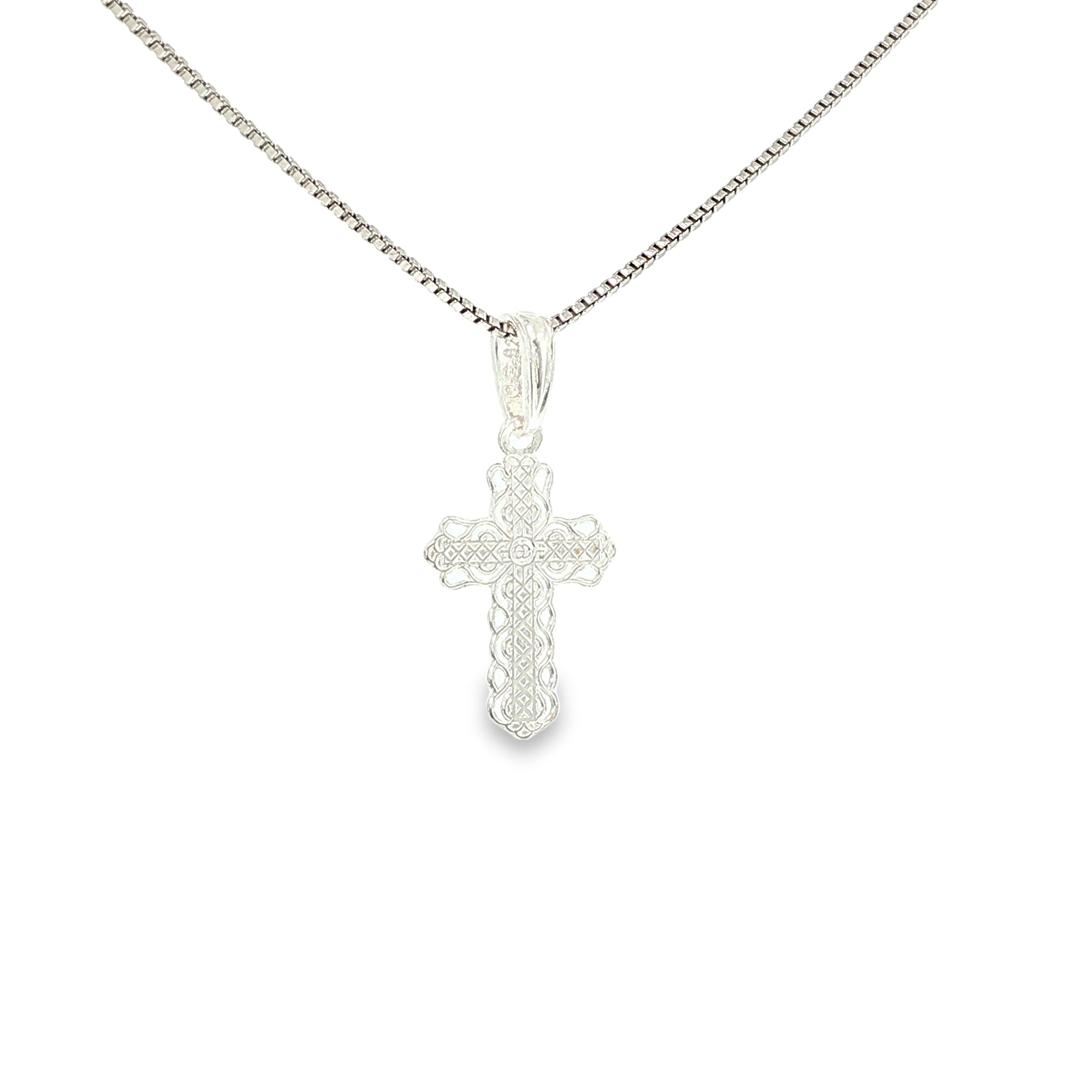 Sterling silver cross pendant with intricate lace-like textured detailing.