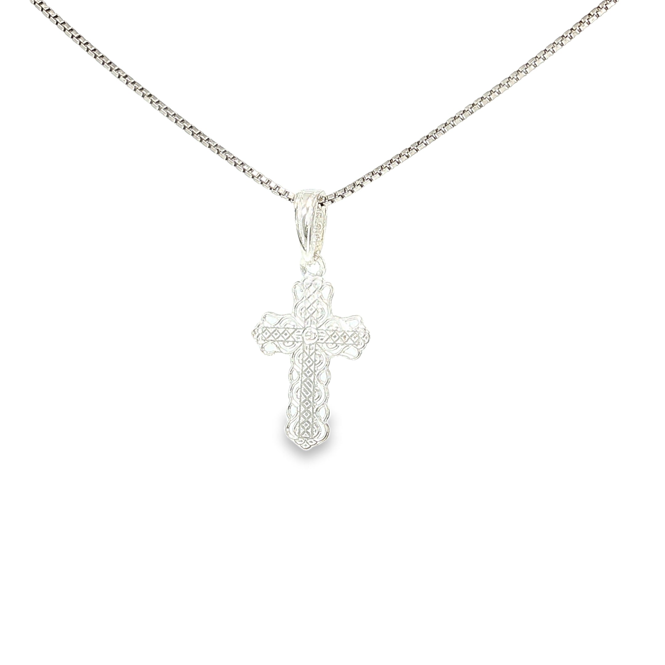 Sterling silver cross pendant with intricate lace-like textured detailing.