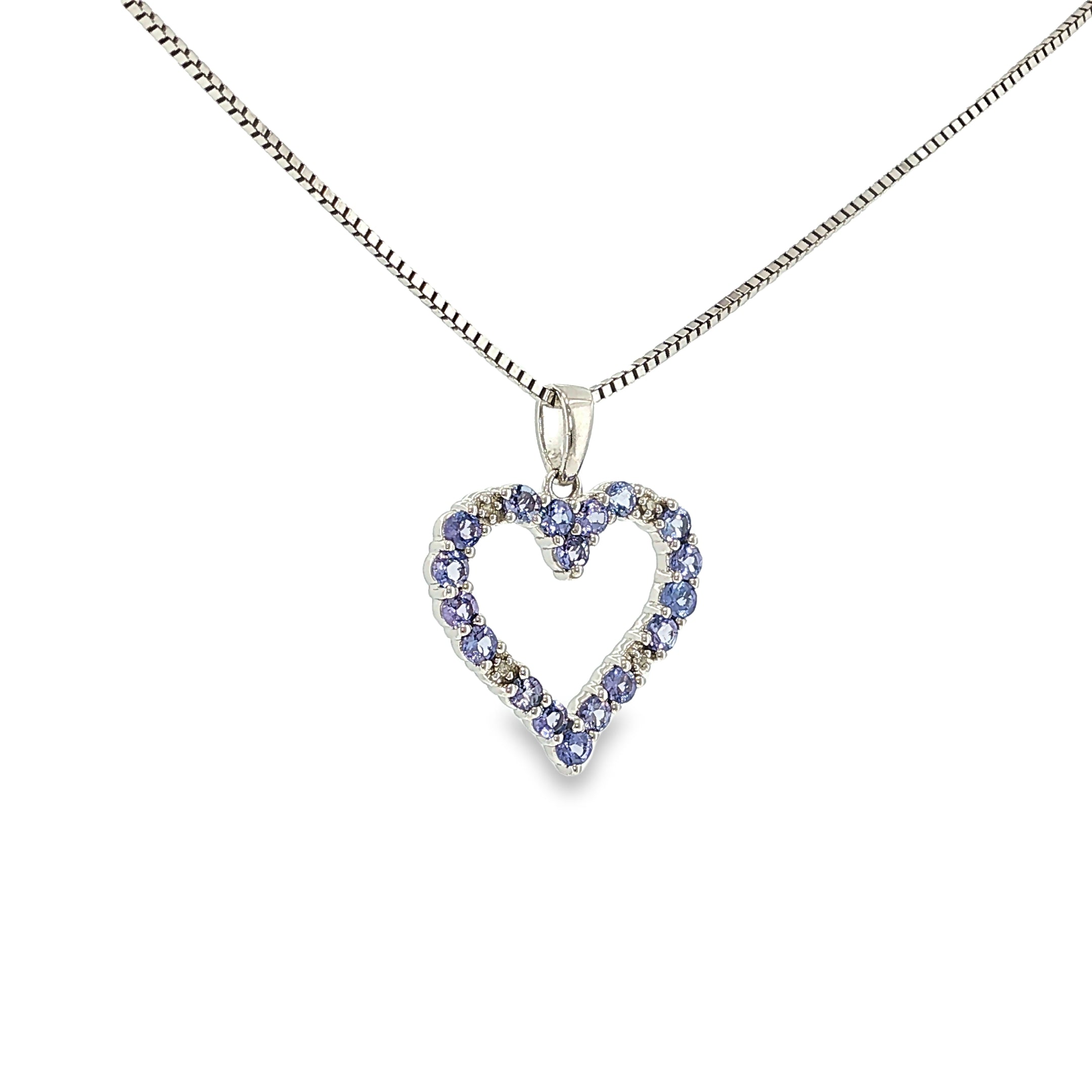 Sterling silver open heart pendant with tanzanite gemstones and a small diamond accent.